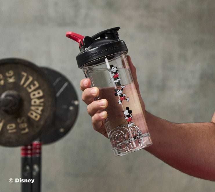 pro-series-i8 Mickey_Mouse_Protein_Shaker_Bottle_Being_Held_In_the_Gym.jpg